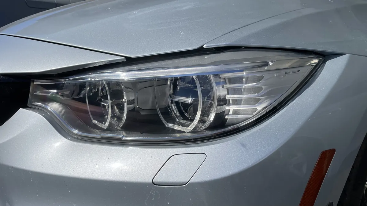 After professional headlight restoration on 2013 BMW 3-Series (Passenger Side) in Tucson, AZ with UV protection applied.