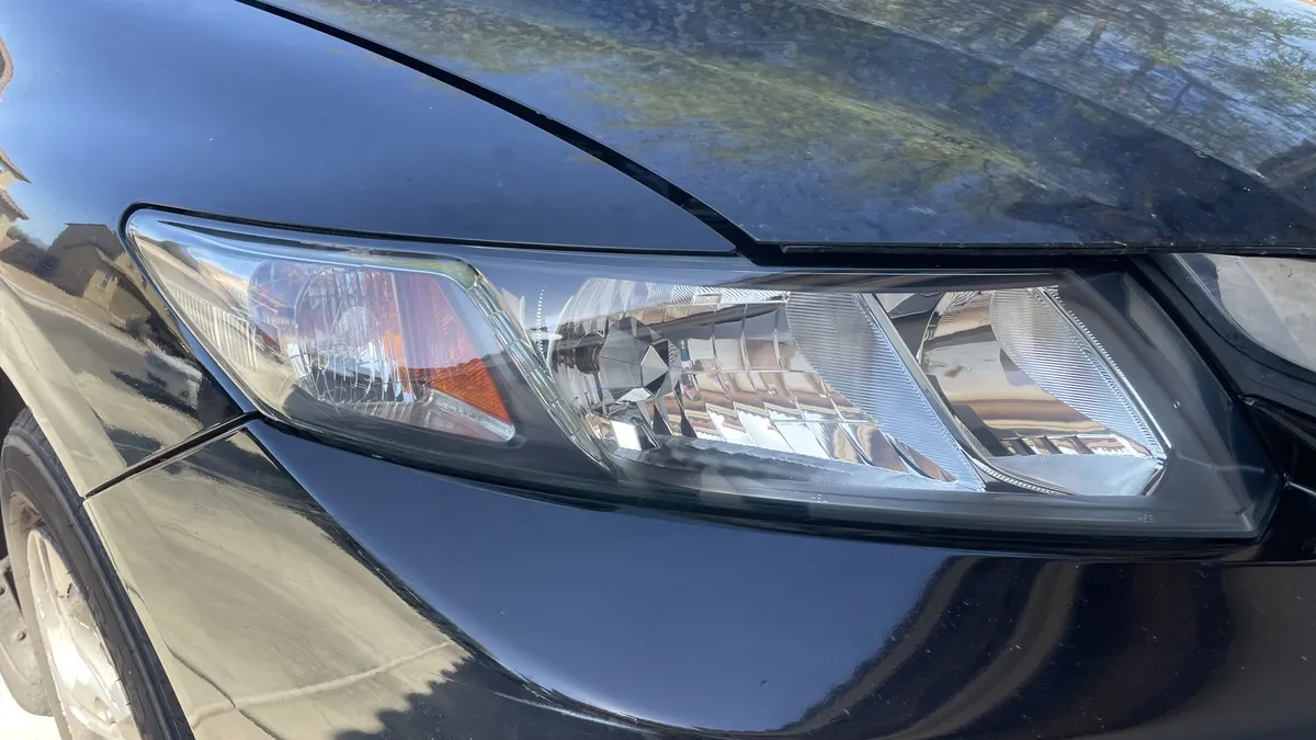 After professional headlight restoration on 2013 Honda Civic in Tucson, AZ with UV protection applied.