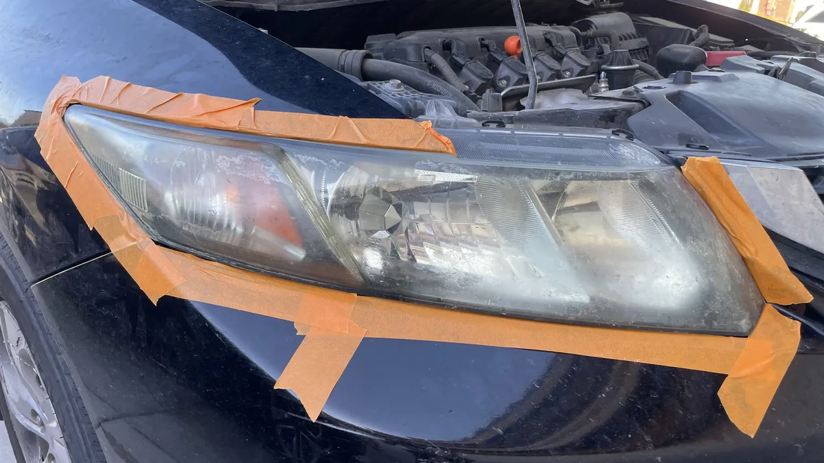 Before professional headlight restoration on 2013 Honda Civic in Tucson, AZ showing severe lens oxidation.