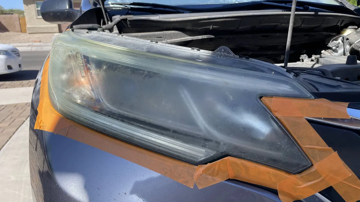 Before professional headlight restoration on 2018 Honda CR-V in Tucson, AZ showing severe lens oxidation.