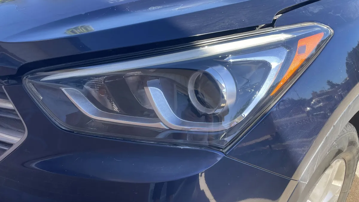 After professional headlight restoration on 2015 Hyundai Santa Fe in Tucson, AZ with UV protection applied.