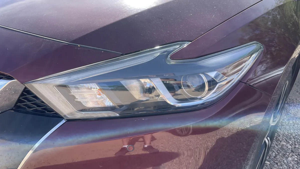 After professional headlight restoration on 2016 Nissan Maxima in Tucson, AZ with UV protection applied.