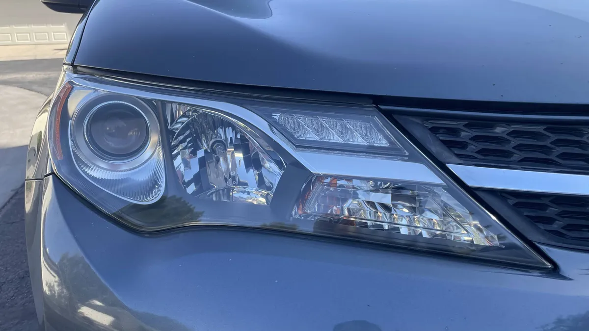 After professional headlight restoration on 2014 Toyota RAV4 in Tucson, AZ with UV protection applied.