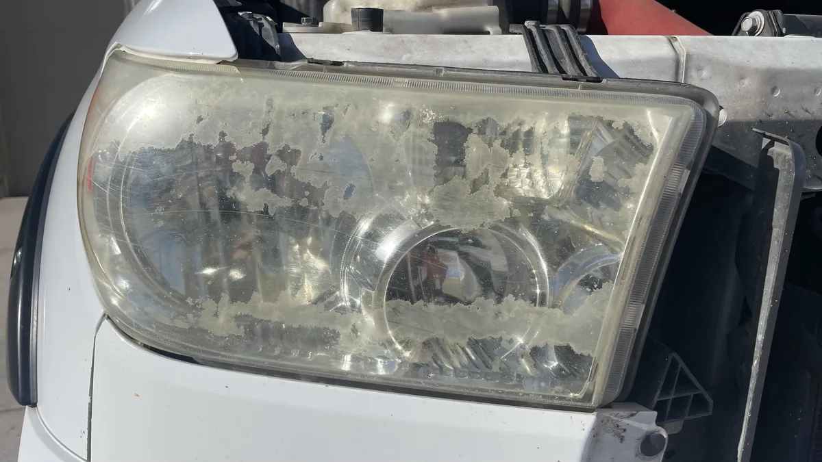 Before professional headlight restoration on 2003 Toyota Tundra in Tucson, AZ showing severe lens oxidation.