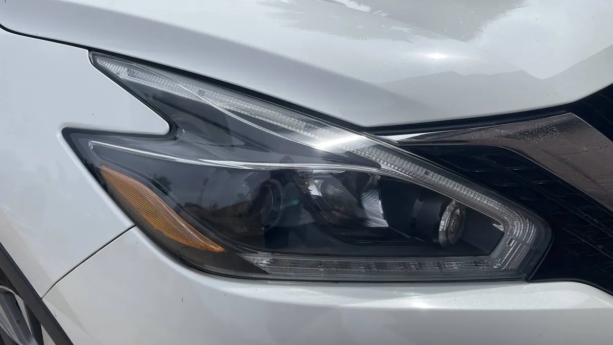 Restored headlight lens with UV protection after professional correction