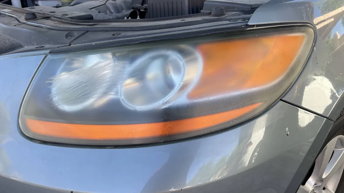 Cloudy headlight lens before evaluating vapor headlight restoration in Arizona