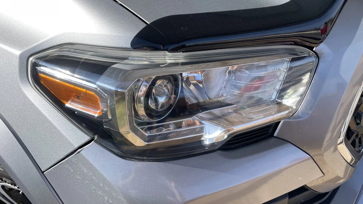 Restored clear Toyota Tacoma headlight lens after professional mobile restoration in Sahuarita